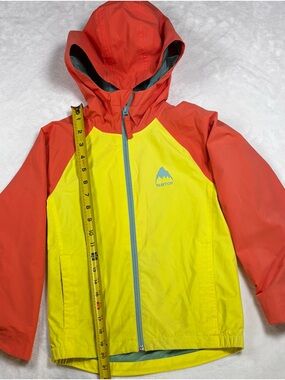 Burton girls XS lightweight poly jacket in vibrant yellow‑orange tones